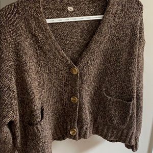 Brown cardigan , never warn